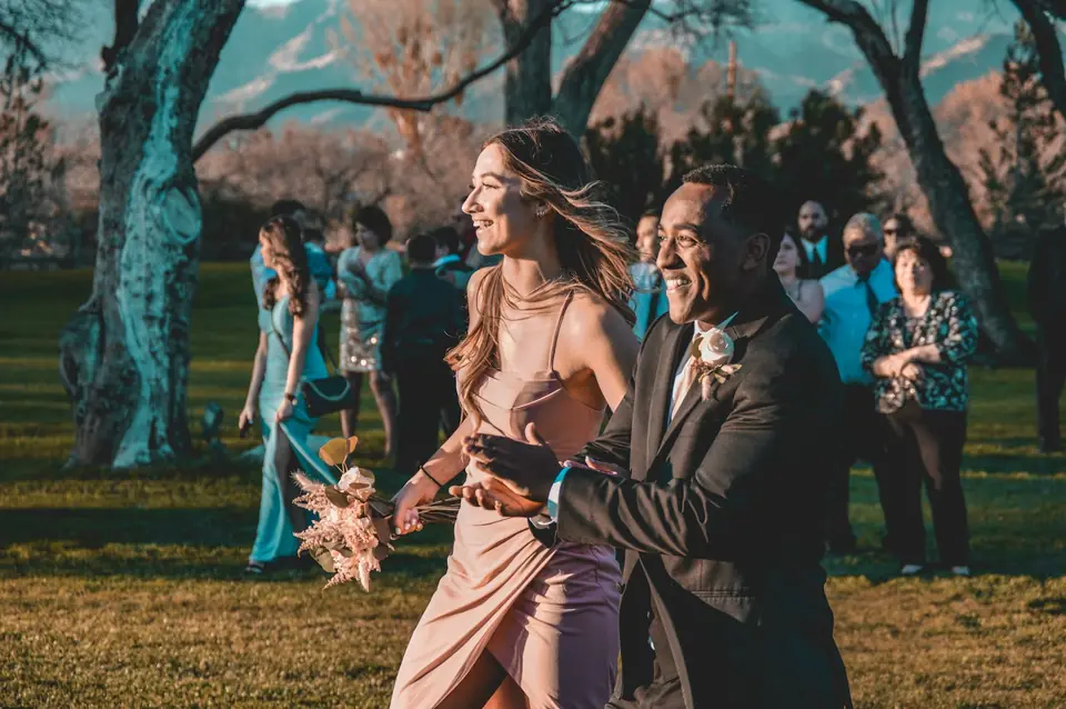 Wedding guests dancing on the lawn